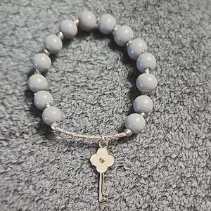 Gray Beaded Stretch Bracelet with Silver Key Charm